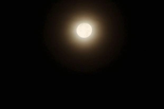Near-full moon setting over Portland, Oregon, on the Winter Solstice