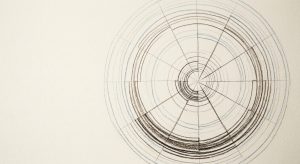 A central circle radiating outward with fine, balanced spokes and intersecting lines, matching your non-linear concept of memory.